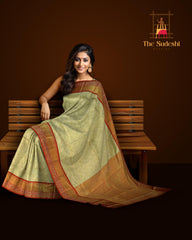 Light Green Kanchipuram Silk Saree with Tissue, Embossed, Meenakari, Brocade on the body with red contrast border and pallu featuring rudraksham, grand, creeper design with rich pallu