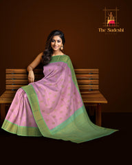Rose milk pink Kanchipuram Silk Saree with Motif on the body with pista green contrast border and pallu featuring annam, rudraksham, grand, zig zag pattern intricately designed