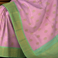 Rose milk pink Kanchipuram Silk Saree with Motif on the body with pista green contrast border and pallu featuring annam, rudraksham, grand, zig zag pattern intricately designed
