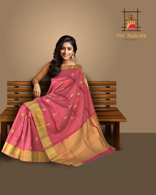 Graceful Coral Pink Kanchipuram Silk Saree with Delicate Butta Motifs