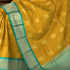 Luminous Yellow Kanchipuram Silk Saree with Elegant Bhuttas - Vibrant Traditions