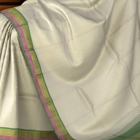 Pristine Off White Kanchipuram Silk Saree with Multi-Color Plain Design - Understated Elegance