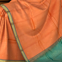 Peachish Orange Kanchipuram Silk Saree with Small Bhuttas & Bluish Green Accents - Delicate Charm