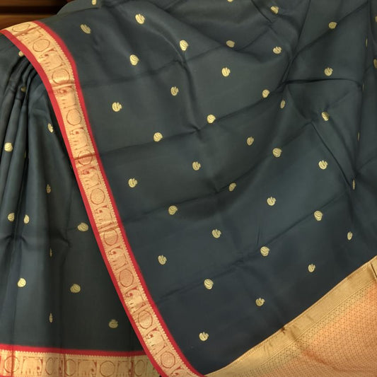 Black Kanchipuram Silk Saree with Red Border and Tear-Shaped Buttas