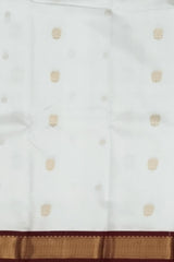 White Kanchipuram Silk Saree with Maroon Border and Floral Buttas