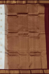 White Kanchipuram Silk Saree with Maroon Border and Floral Buttas