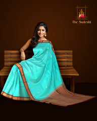 Sky Blue Kanchipuram Silk Saree with Maroon Border and Small Floral Buttas