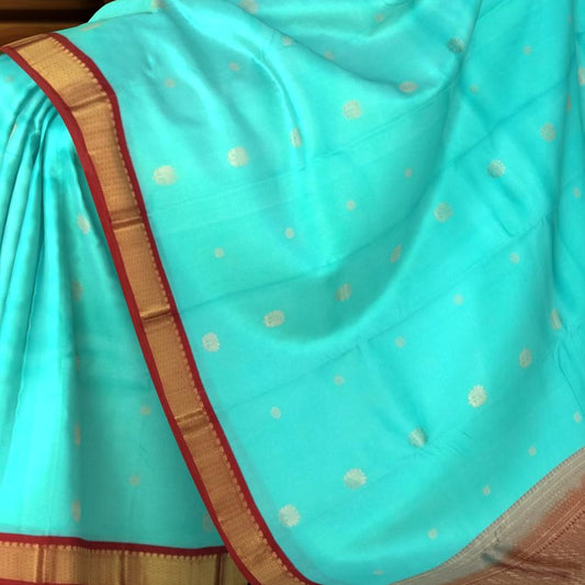 Sky Blue Kanchipuram Silk Saree with Maroon Border and Small Floral Buttas