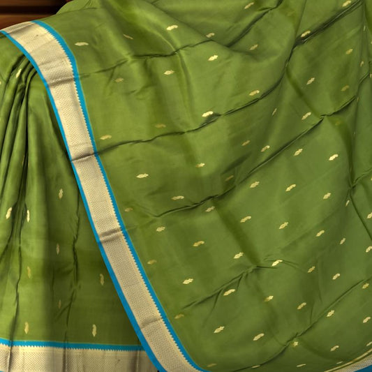 Powder Blue Kanchipuram Silk Saree with Coral Pink Border and Floral Zari Motifs