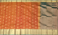 Rust Orange Kanchipuram Silk Saree with Dual Tone Gold Zari Border and Buttas