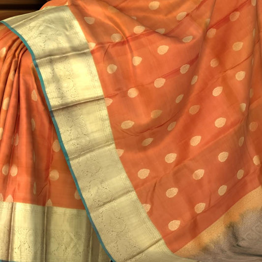 Rust Orange Kanchipuram Silk Saree with Dual Tone Gold Zari Border and Buttas