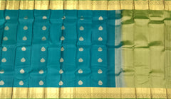 Peacock Green Kanchipuram Silk Saree with Self Green Border and Tear-Shaped Buttas