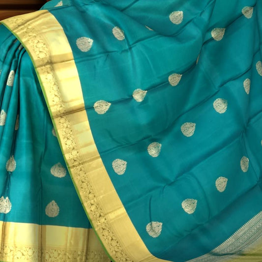 Peacock Green Kanchipuram Silk Saree with Self Green Border and Tear-Shaped Buttas