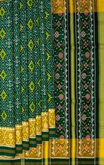 Dark Green Pan Chanda Border Pallu Ghughro (White Design) Single Ikat Rajkot Patola Saree