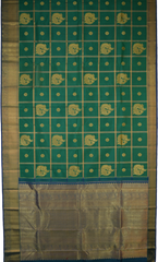 Green Kanchipuram Silk Saree with Annam checks on the body with Blue contrast border and Blue Grand Peacock Motif Pallu with Diamond Design