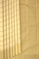 Off White Kanchipuram Silk Saree with Zari Checks on the body with Off White self border and off white grand pallu with diagonal lines. Intricatetly designed with mangoes, rudraksham and Aramadam