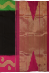 Black Kanchipuram Silk Saree with Plain on the body with Ganga Jamuna Border (1 side green, 1 side pink) border and Pink 8 Kol Pallu with Seepu Reku with bold temple