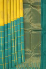 Yellow Kanchipuram Silk Saree with Half half- Mango Plain on the body with Turqoise Blue contrast Checks raindrops border and Turqoise Blue 8 Kol grand tissue pallu with seepu raku