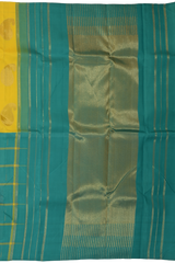 Yellow Kanchipuram Silk Saree with Half half- Mango Plain on the body with Turqoise Blue contrast Checks raindrops border and Turqoise Blue 8 Kol grand tissue pallu with seepu raku