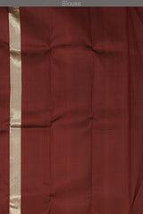 Maroon Kanchipuram Silk Saree with temple border on the body with Maroon self border and Maroon Grand Tissue Pallu