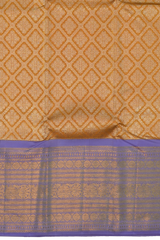 Light Orange Kanchipuram Silk Saree with large diamond motif design on the body with lavender contrast border featuring varusai pet border and annam, small diamond designs in pallu
