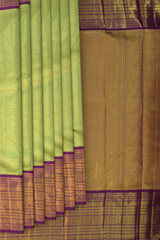 Lime Green Kanchipuram jacquard Silk Saree with intricately designed patterns on the body with wine purple vaada malli contrast border and peacock, diamond designs in pallu