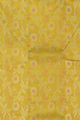 Yellow Kanchipuram Silk Saree with pink flower designs on the body with pista green contrast border and grand floral design with diamond motif in pallu