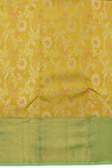 Yellow Kanchipuram Silk Saree with pink flower designs on the body with pista green contrast border and grand floral design with diamond motif in pallu