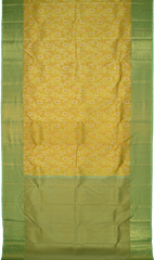 Yellow Kanchipuram Silk Saree with pink flower designs on the body with pista green contrast border and grand floral design with diamond motif in pallu