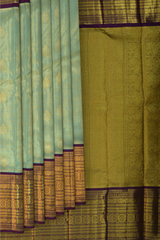 Light Blue Kanchipuram Tissue Silk Saree with embossed designs on the body with violet contrast border and annam, gatti pallu, and grand designs in pallu