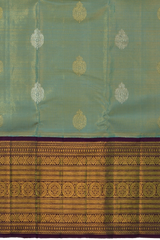 Light Blue Kanchipuram Tissue Silk Saree with embossed designs on the body with violet contrast border and annam, gatti pallu, and grand designs in pallu