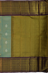 Light Blue Kanchipuram Tissue Silk Saree with embossed designs on the body with violet contrast border and annam, gatti pallu, and grand designs in pallu