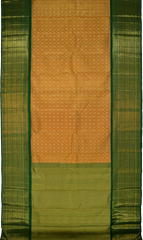 Light Orange Kanchipuram Tissue Silk Saree embossed, and intricately designed silver and gold butta on the body with leaf green contrast border and annam, grand, kuyil kan designs in pallu