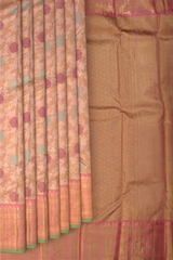 Light Baby Pink Kanchipuram Silk Saree with floral, embossed, and meenakari designs on the body with candy pink with green selvage contrast border and tear shaped motif with diamond design in pallu