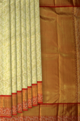 Light Green Kanchipuram Silk Saree with Tissue, Embossed, Meenakari, Brocade on the body with red contrast border and pallu featuring rudraksham, grand, creeper design with rich pallu