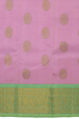 Rose milk pink Kanchipuram Silk Saree with Motif on the body with pista green contrast border and pallu featuring annam, rudraksham, grand, zig zag pattern intricately designed