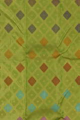 Lime green Kanchipuram Silk Saree with Tissue, Embossed, Meenakari, Diamond design with multicolour threadwork on the body with light green with lavender selvage contrast border and pallu featuring grand, floral intricately designed grand pallu