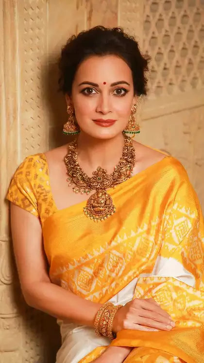 Dia Mirza radiates elegance in a breathtaking yellow and white silk saree