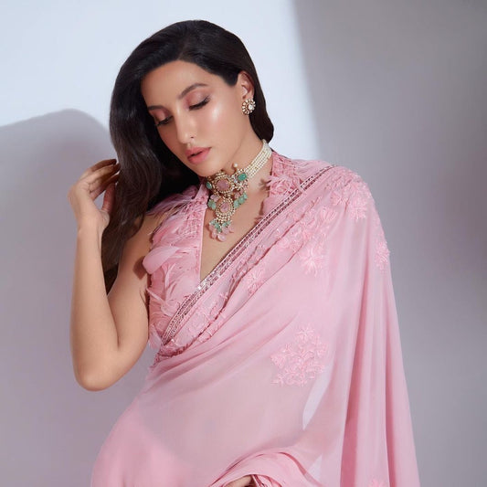 Regal Elegance: Nora Fatehi Dazzles in a Pink Embroidered Saree