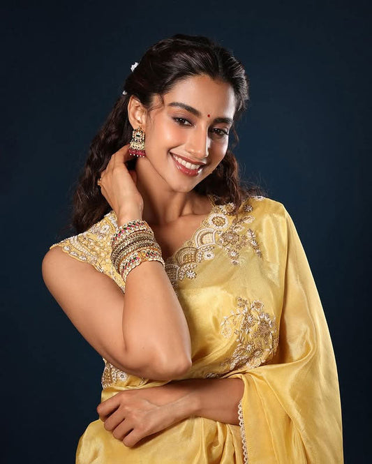 Meenakshi Chaudhary Graces the Event in a Stunning Saree