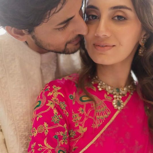 Darshan Raval's Royal Sherwani and Dharal Surelia's Radiant Pink Saree Steal the Spotlight at Wedding Festivities