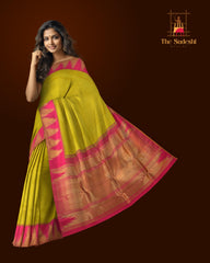 Lime Green Kanchipuram Silk Saree with Plain on the body with Rani Pink contrast Temple border and Rani Pink 8 Kol grand tissue pallu with seepu raku