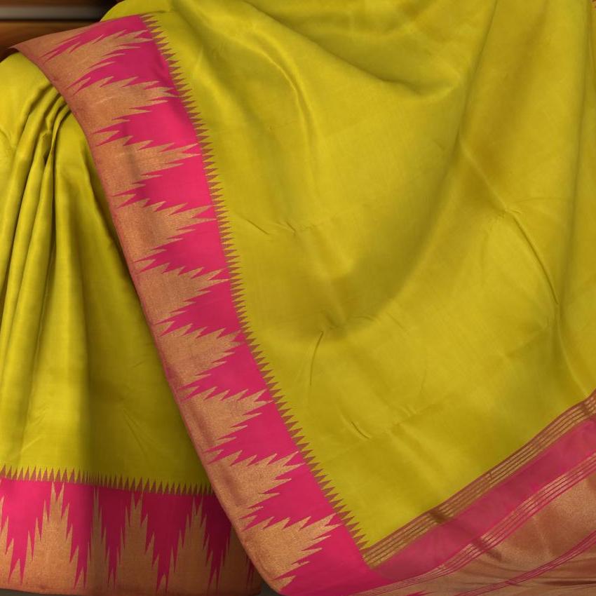 Lime Green Kanchipuram Silk Saree with Plain on the body with Rani Pink contrast Temple border and Rani Pink 8 Kol grand tissue pallu with seepu raku