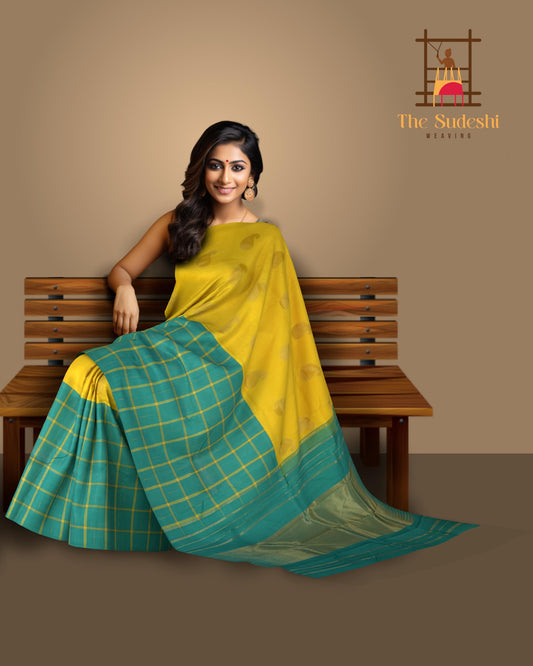 Yellow Kanchipuram Silk Saree with Half half- Mango Plain on the body with Turqoise Blue contrast Checks raindrops border and Turqoise Blue 8 Kol grand tissue pallu with seepu raku