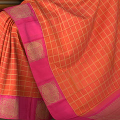 Orange and Pink Kanchipuram Silk Saree with Dual Tone Checks on the body with Pink contrast Annapakshi as blocks in border and Pink Grand Pink zig zag patter pallu