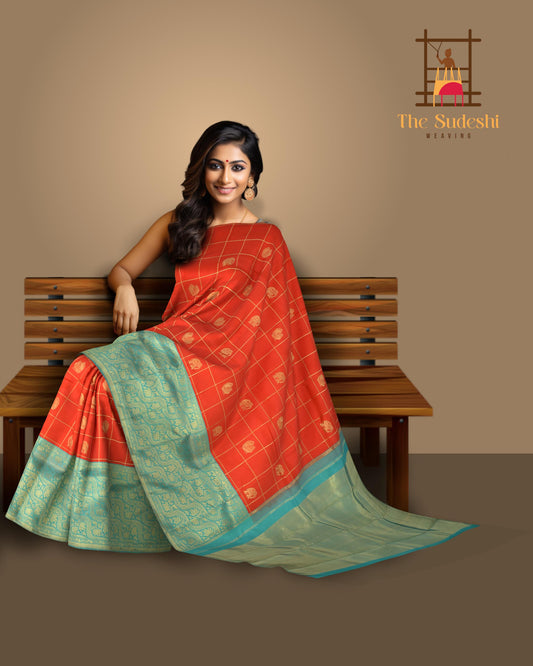 Red Kanchipuram Silk Saree with Checks on the body with Turqoise Blue contrast Lotus Border and Blue Blue Tissue Pallu. Grand.