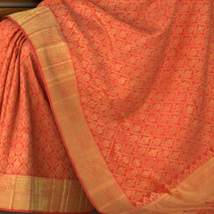 Coral Pink Kanchipuram Silk Saree with Jackard body with Lotus and bavanshi Self border and Tissue with floral embossed design Pallu