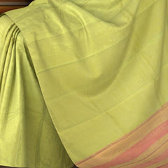 Green Kanchipuram Silk Saree with Tissue Plain Tissue body with Plain Self border and Pink Tissue Pallu with green lines