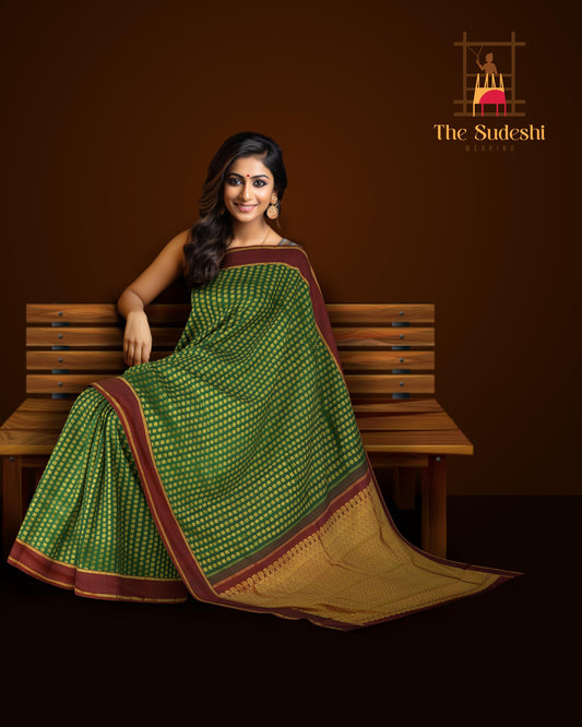 Bottle Green Kanchipuram Silk Saree with Butta peacock on the body with Maroon contrast border and Grand Maroon Pallu Intricately design Semi circle pattern with mango motif