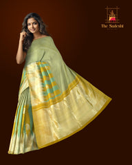 Light Green Kanchipuram Silk Saree with Long Border on the body with Mustard and Green dual color border and 8 Kol Seepu Reku Grand Tissue Pallu. Silver Zari.